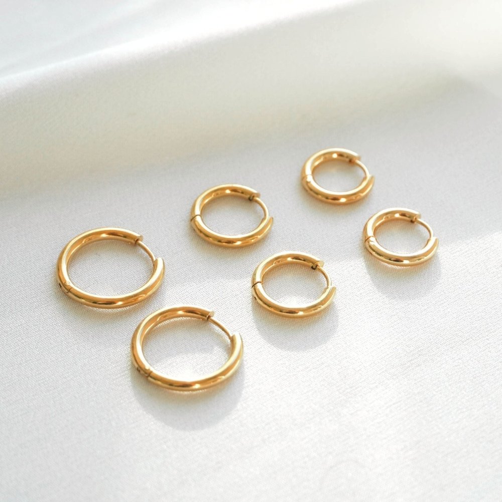 Pendientes de aro triples dorados