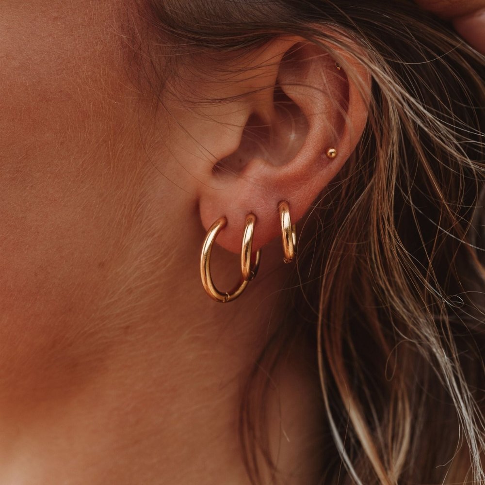 Pendientes de aro triples dorados